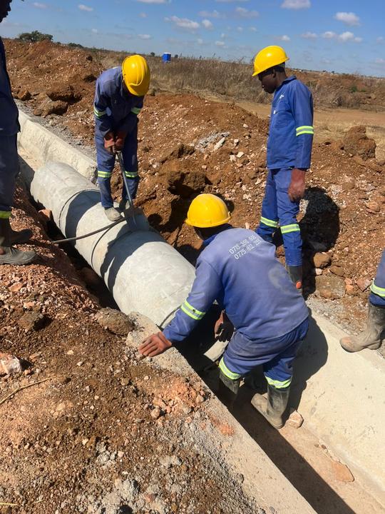 Crew laying culvert pipes