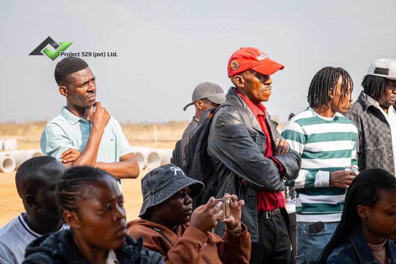 Buyers listening during a site briefing