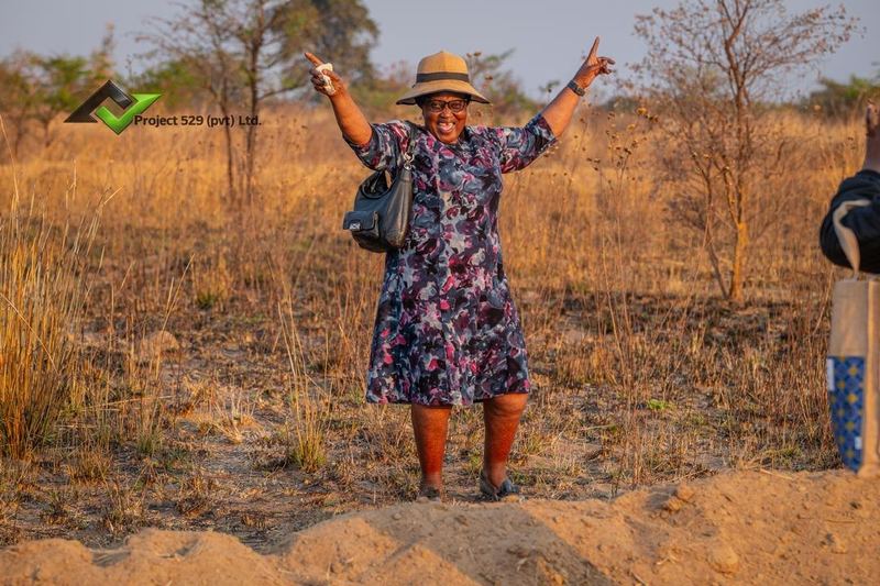 A visitor celebrating on site at Summer Greens