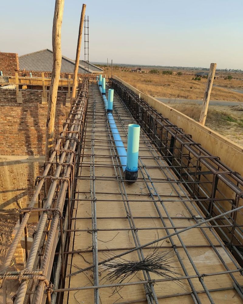 Reinforcing steel and plumbing in a slab