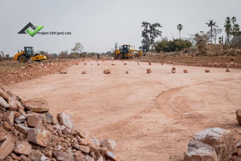 A new road bed with the graders beyond