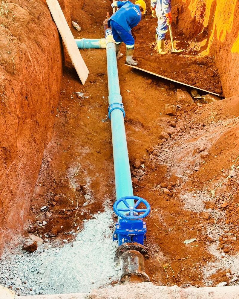 A water main and valve in the trench